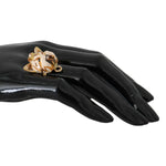 Dolce & Gabbana Gold Brass Resin Beige Dog Pet Accessory Ring displayed on black hand.