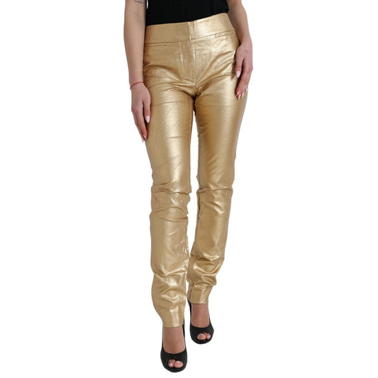 Woman wearing Dolce & Gabbana Gold High Waist Skinny Women Metallic Pants with minor defects.