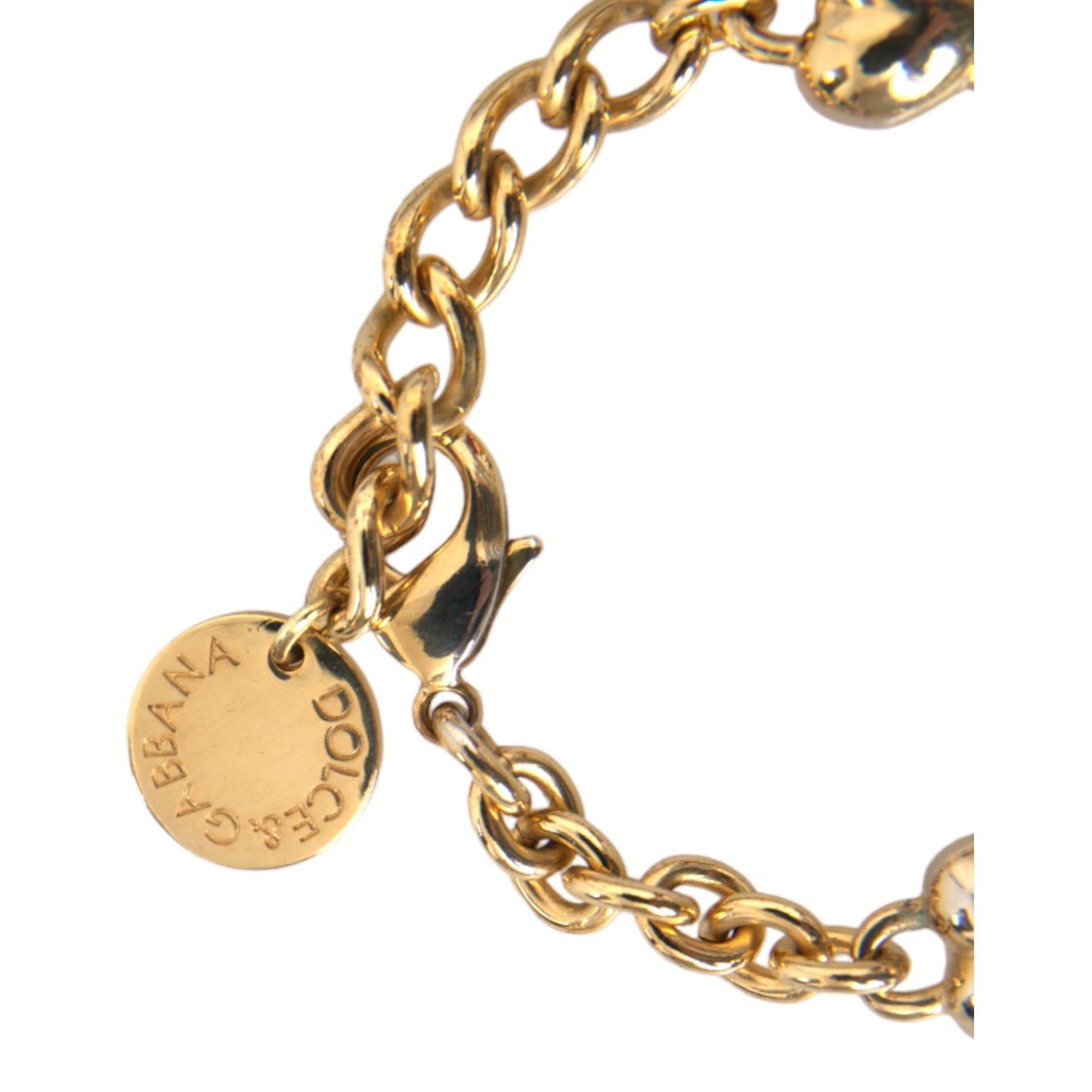Dolce & Gabbana Gold Tone Brass Chain MY DOG Heart Bracelet close-up with logo and lobster closure, women's fashion accessory.