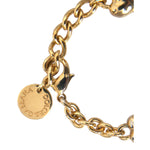 Dolce & Gabbana Gold Tone Brass Chain MY DOG Heart Bracelet close-up with logo and lobster closure, women's fashion accessory.