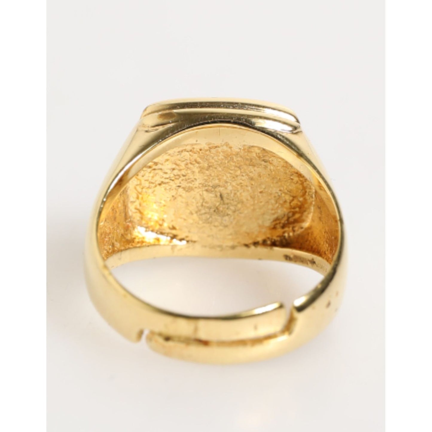 Dolce & Gabbana Gold Tone Enamel Brass Signet DG Logo Adjustable Ring, inside view showcasing brass material and adjustable design.
