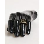 Dolce & Gabbana Gold Tone Enamel Brass Signet DG Logo Adjustable Ring on mannequin hand