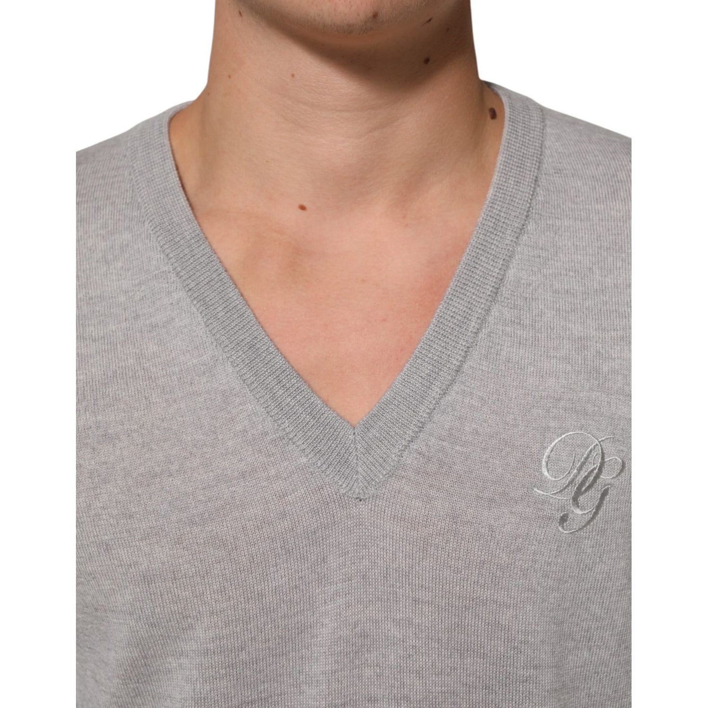Dolce & Gabbana Gray Wool Knit Logo V-Neck Pullover Sweater with logo detail, crafted from luxurious virgin wool, perfect for layering.