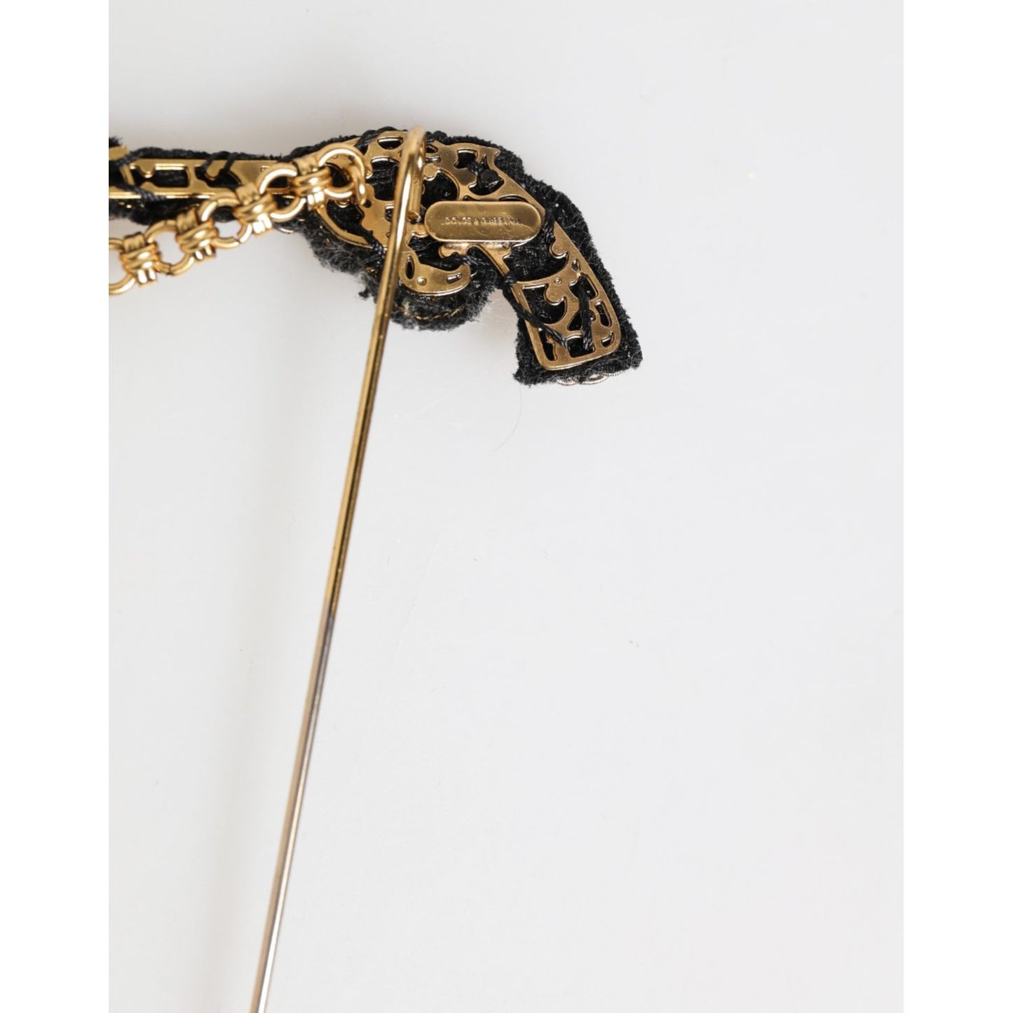Dolce & Gabbana Lapel Pin Brass Copper Revolver Men Accessories Brooch with gold-tone finish on white background.