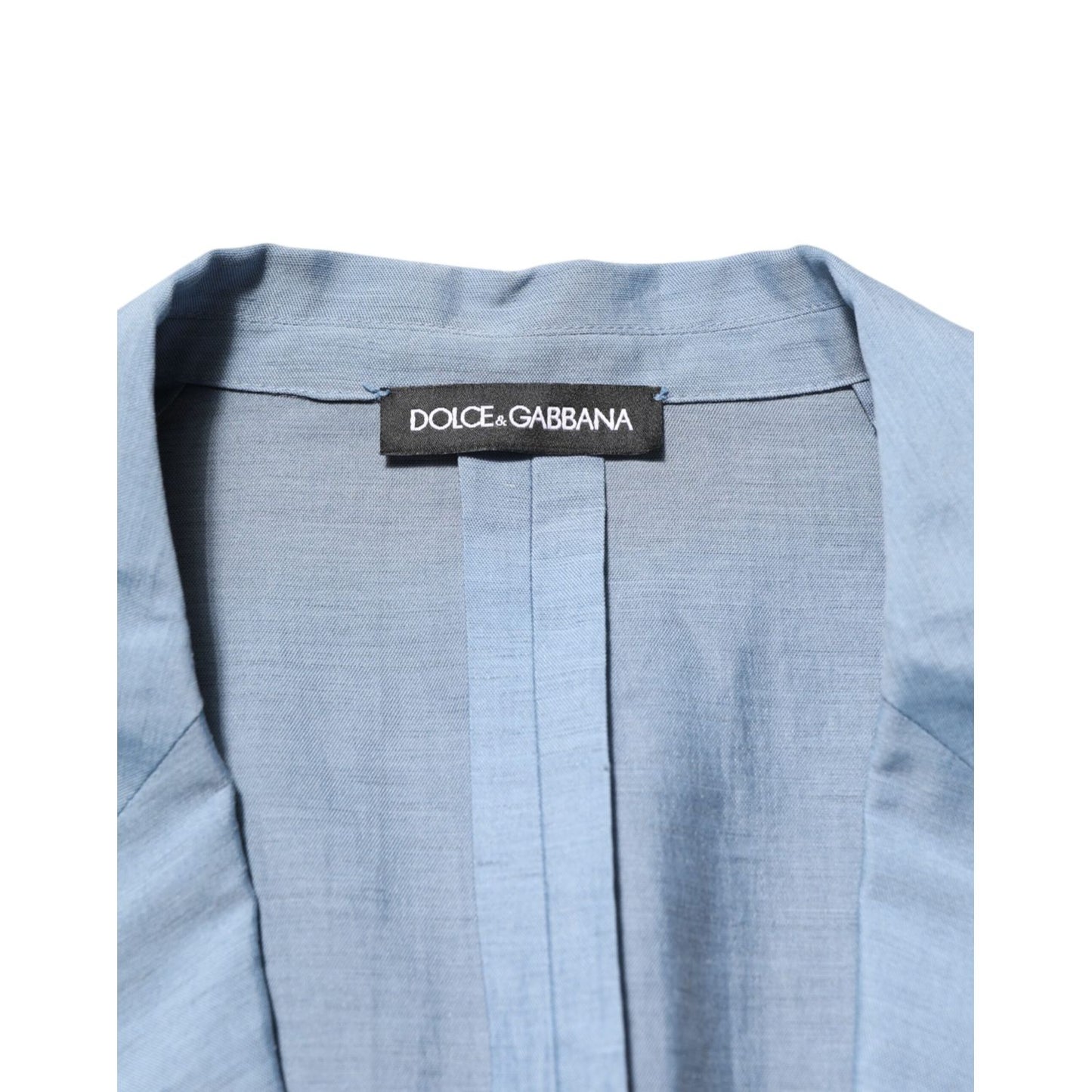Close-up of Dolce & Gabbana Light Blue Linen Double Breasted Men Jacket Blazer with brand label on inner lining.