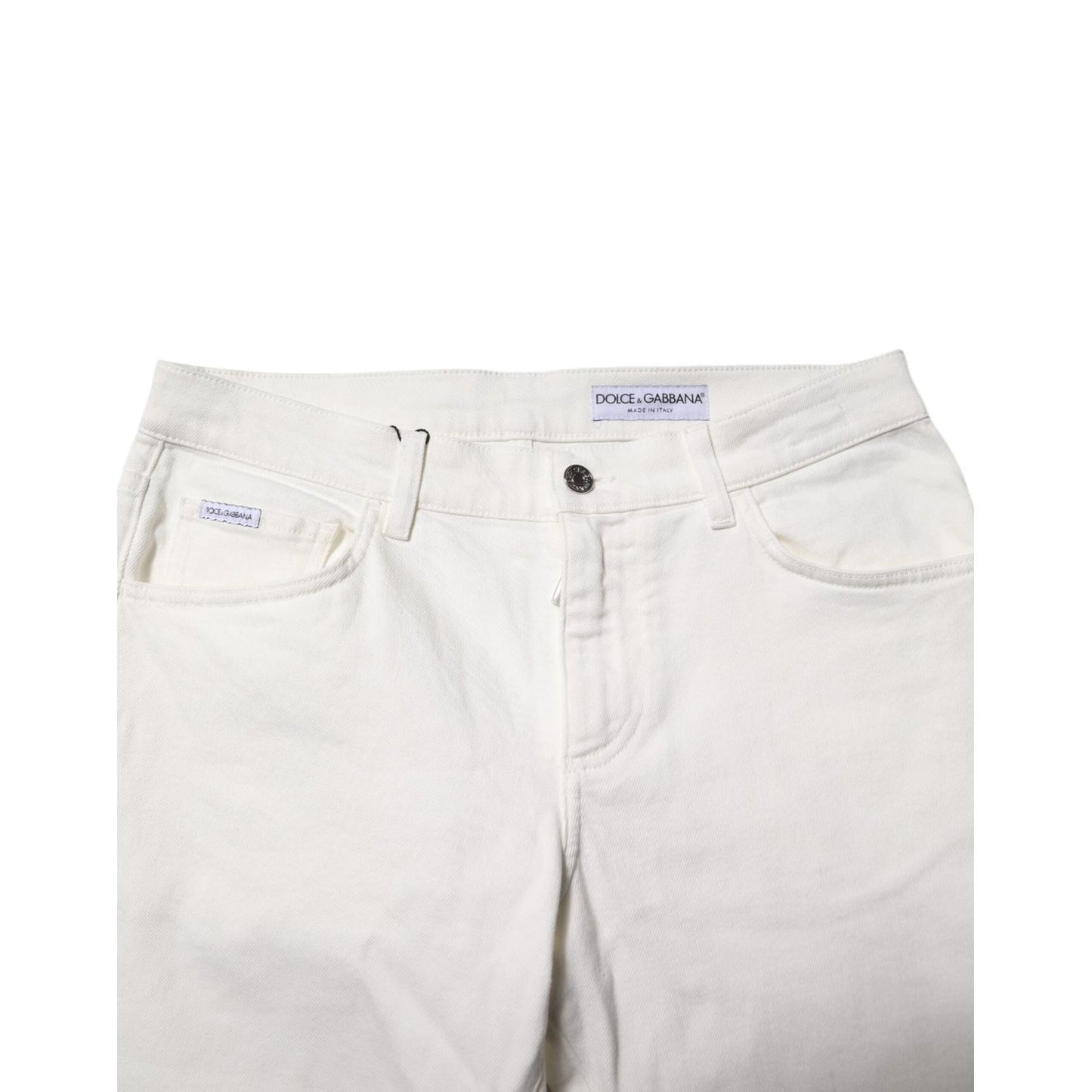 Dolce & Gabbana Off White Cotton Stretch Slim Fit Denim Jeans close-up featuring zip-button closure and five-pocket design.