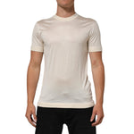 Dolce & Gabbana Off White Silk Crew Neck Short Sleeve T-shirt worn by a model, showcasing luxury Italian craftsmanship and elegant design.