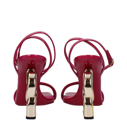 Dolce & Gabbana Pink Leather Stiletto Heel Sandals in fuchsia, gold accents, back view with buckle closure and open toe design.