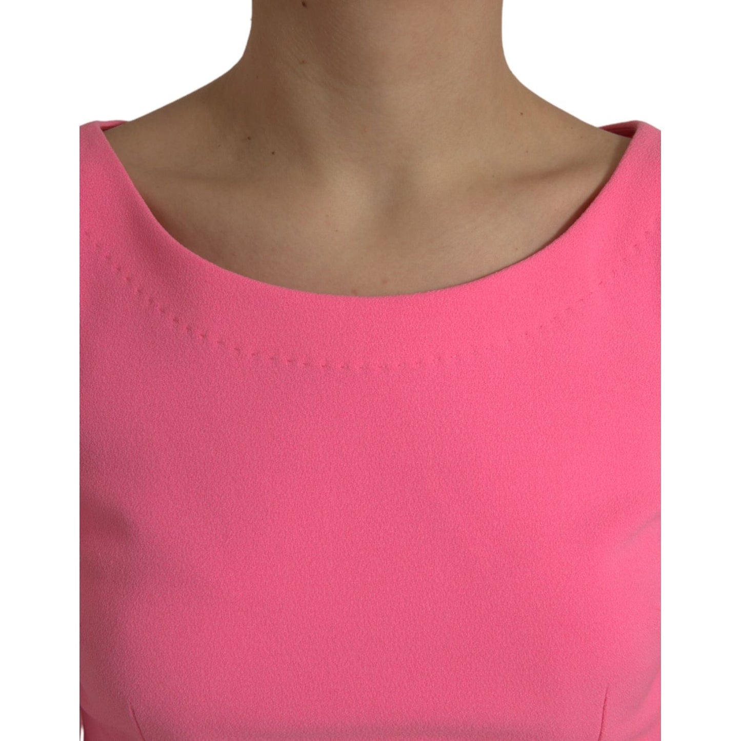Close-up of Dolce & Gabbana Pink Polyester Long Sleeves Sheath Midi Dress showcasing neckline detail.
