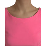 Close-up of Dolce & Gabbana Pink Polyester Long Sleeves Sheath Midi Dress showcasing neckline detail.
