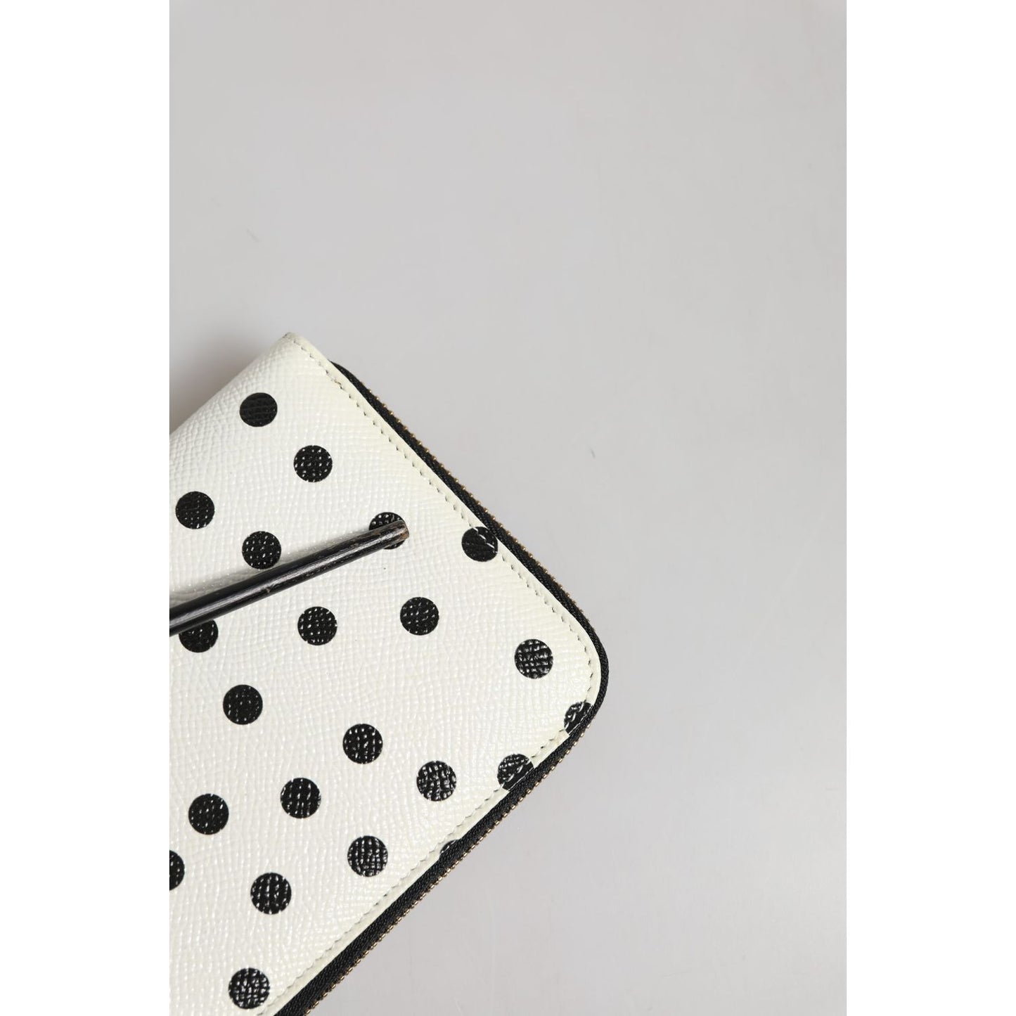 Dolce & Gabbana White Black Dotted Leather Zip Around Continental Wallet with metal hardware and zipper fastening.