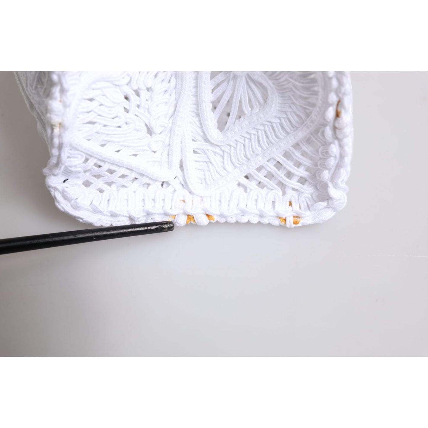 Close-up of Dolce & Gabbana White Cordonetto Lace Beatrice Tote Shopping Bag with heart motif in traditional Sicilian lace.