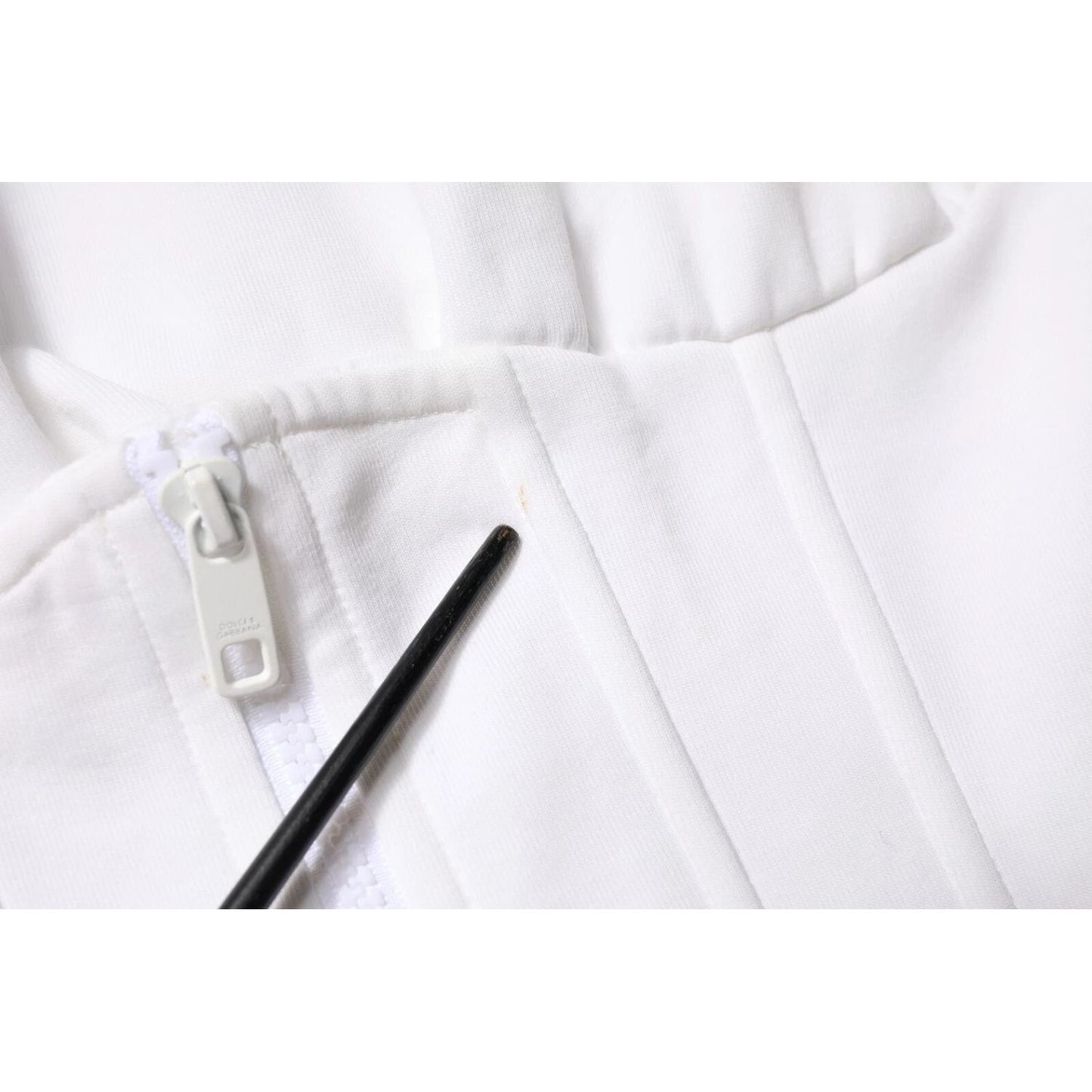 Close-up of zipper on Dolce & Gabbana White Corset Stretch Cotton Top T-shirt showing fabric texture.