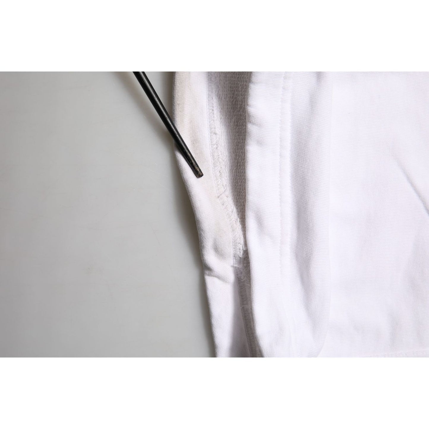 Close-up of Dolce & Gabbana White Cotton Cargo Trousers Logo Patch Pants showing drawstring and premium cotton texture.