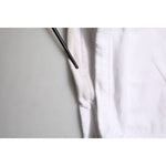 Close-up of Dolce & Gabbana White Cotton Cargo Trousers Logo Patch Pants showing drawstring and premium cotton texture.