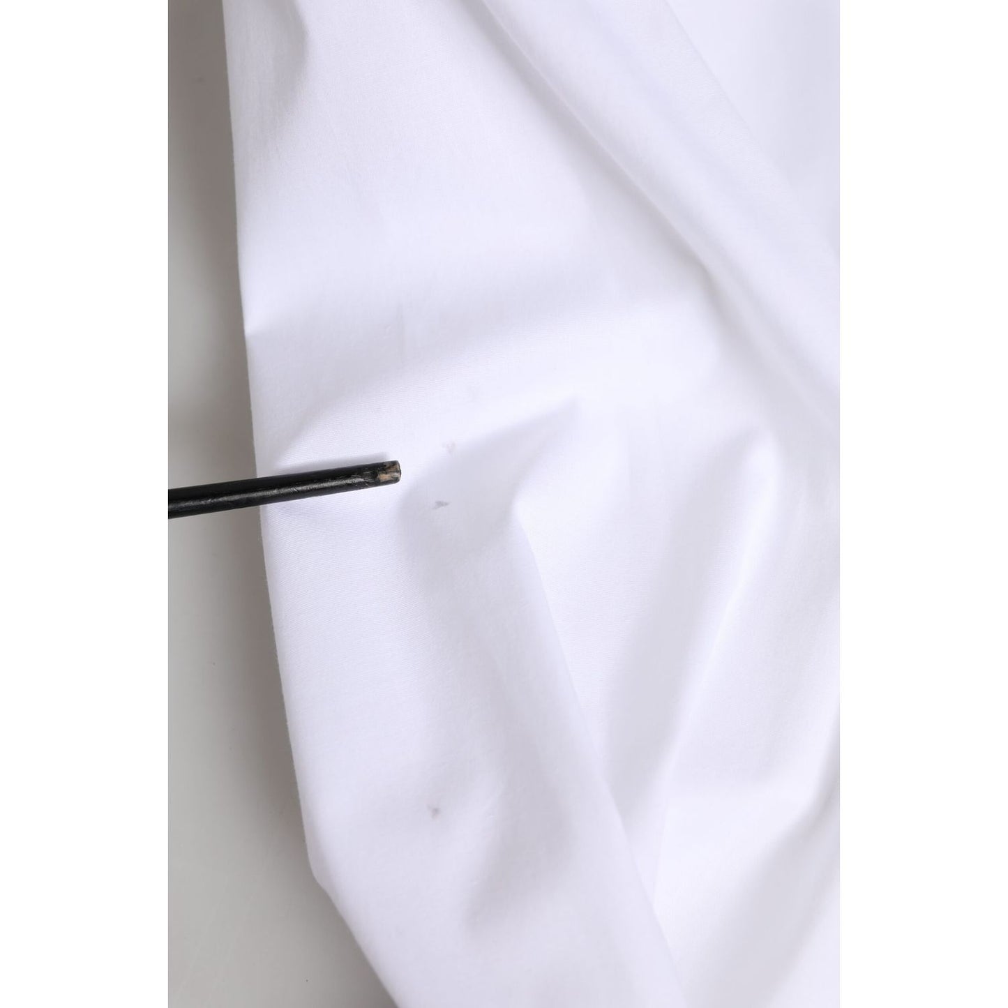 Dolce & Gabbana White Cotton Collared Buttoned Dress Shirt Top showcasing fabric close-up with detail.