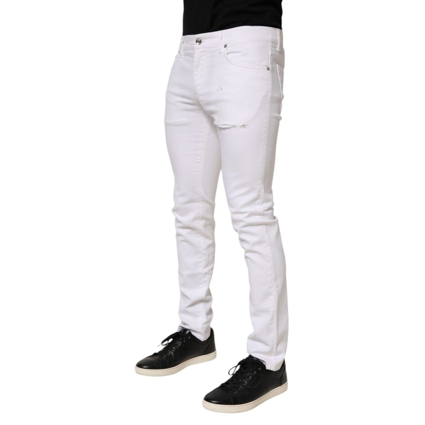 Dolce & Gabbana White Ripped Cotton Skinny Men Denim Jeans on model showcasing front view with black sneakers.