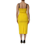 Back view of Dolce & Gabbana Yellow Polyester Sleeveless Sheath Midi Dress showcasing elegant design.