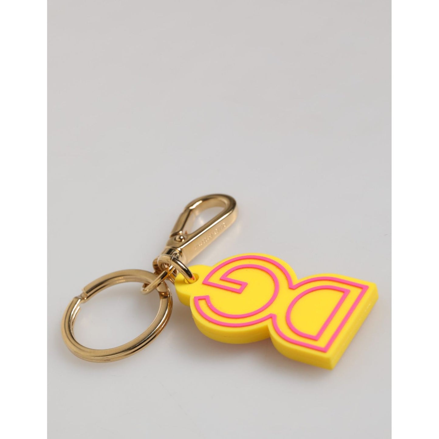 Dolce & Gabbana Yellow Rubber Gold Tone Metal DG Logo Keyring Keychain with logo details and engraved hardware.
