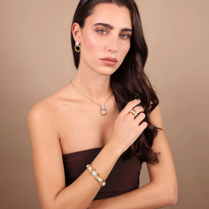 Woman wearing ETRUSCA JEWELS JEWELRY Mod. WSET00867.YG featuring elegant necklace, earrings, ring, and bracelet set against a neutral background.