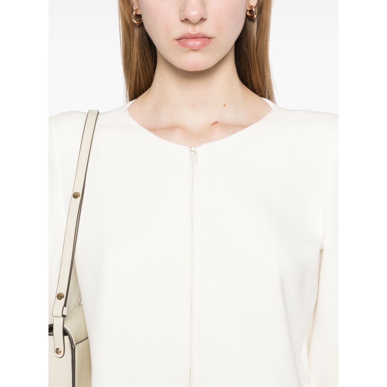Model wearing Emporio Armani Ottoman-jersey jacket with shoulder pads and white two-way zip fastening, showcasing elegant design.