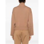 Back view of a Fabiana Filippi Sweaters Camel wool turtle-neck jumper with ribbed cuffs and hem, shown worn by a model.