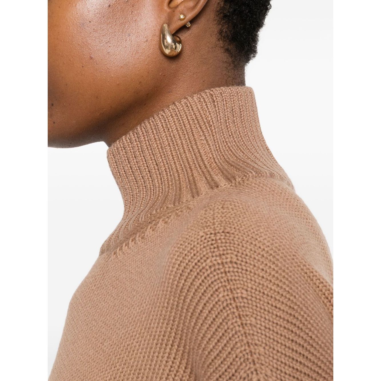 Close-up of a Fabiana Filippi Sweaters Camel showcasing high neck and ribbed texture on model