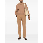 Fabiana Filippi Sweaters Camel high neck wool jumper with ribbed cuffs and hem, worn by model standing with tote bag.