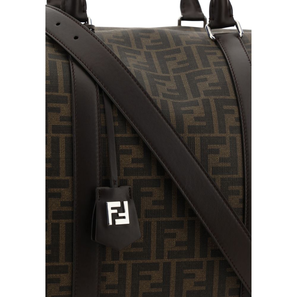 Close-up of Fendi Brown Canvas Luggage And Travel bag with FF monogram and leather handles.