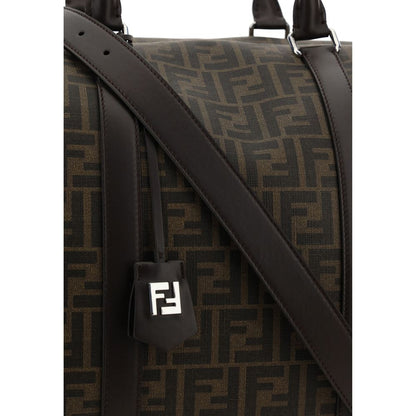 Close-up of Fendi Brown Canvas Luggage And Travel bag with FF monogram and leather handles.