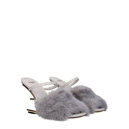 Fendi Gray Mink Slippers with leather sole, high heel, open toe, and side logo in light grey. Casual style, product code F79304.