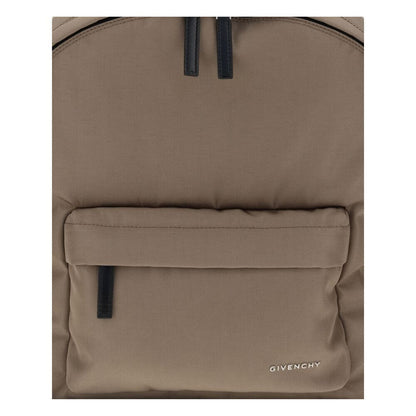 Givenchy Brown Polyamide Backpack with metal logo, front zip pocket, and leather pull tabs. Modern and practical design for everyday use.