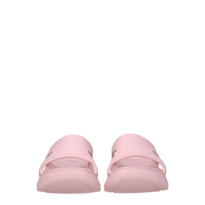 Back view of Givenchy Pink Cotton Slippers with open toe and rubber sole, showcasing casual style and back logo in blush pink.