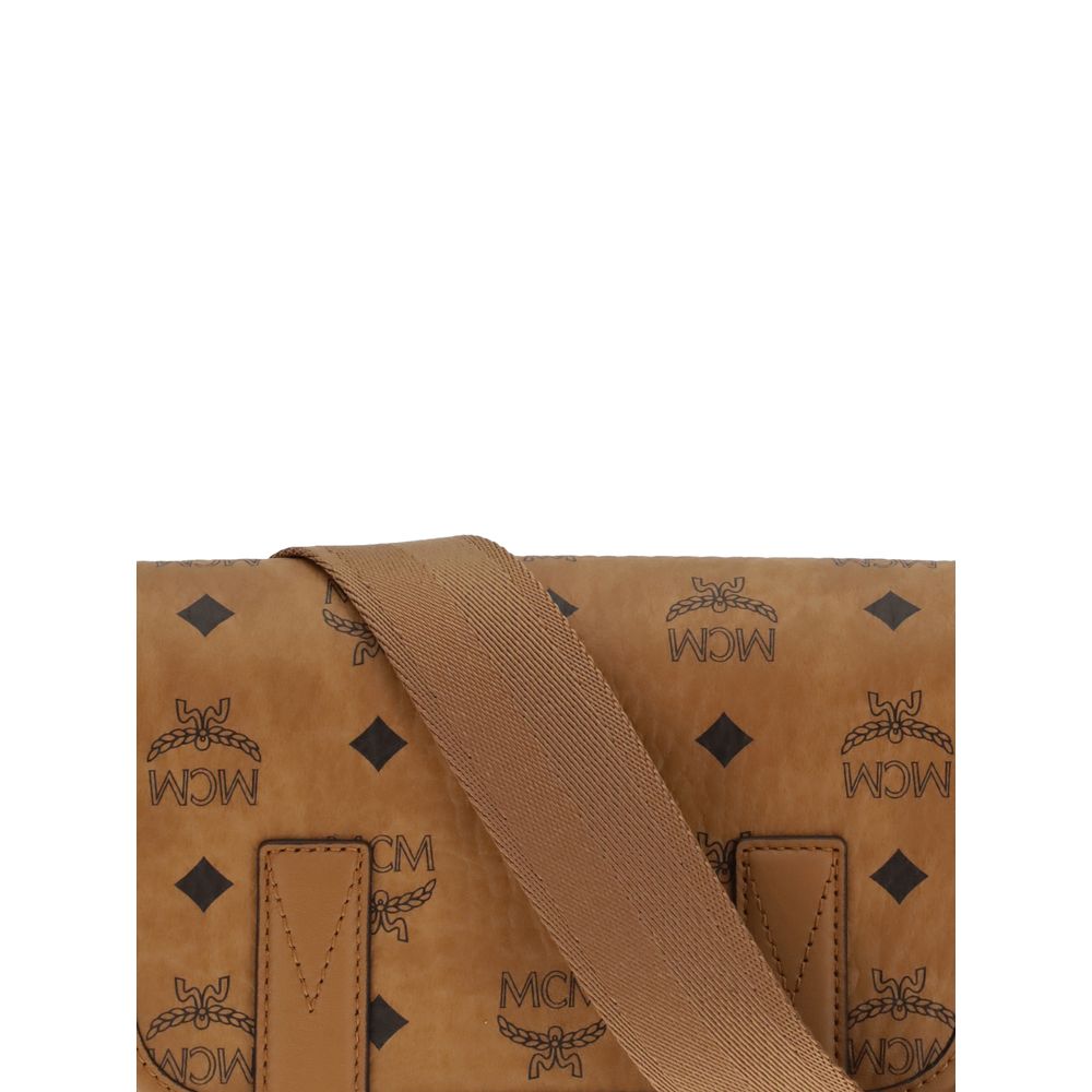 MCM Brown Fabric Shoulder Bag with logo print and elegant rectangular design, featuring rounded profiles and structured front detail.