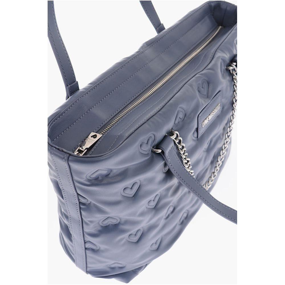 Front view with bag zipped and handles upright.