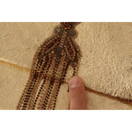 Close-up of Patrizia Pepe Gold Leather Embellished Shoulder Strap Bag showing missing crystal chains.