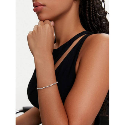 Model wearing SWAROVSKI Mod. 5689633 Matrix Tennis bracelet with Swarovski Crystal Pearls and Zirconia, featuring modern elegance.