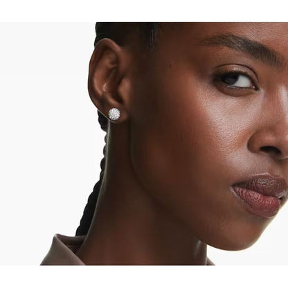 Woman wearing SWAROVSKI Mod. 5700290 silver quartz earrings, close-up view featuring elegant design and sparkling details, perfect for ladies.