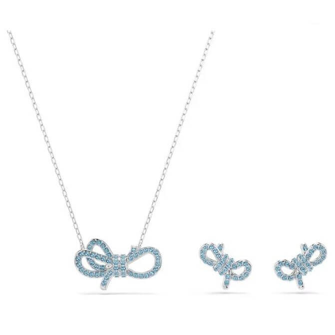 SWAROVSKI Mod. 5723554 Lifelong Bow Set with blue crystals and rhodium plating, featuring necklace and earrings in bow design.