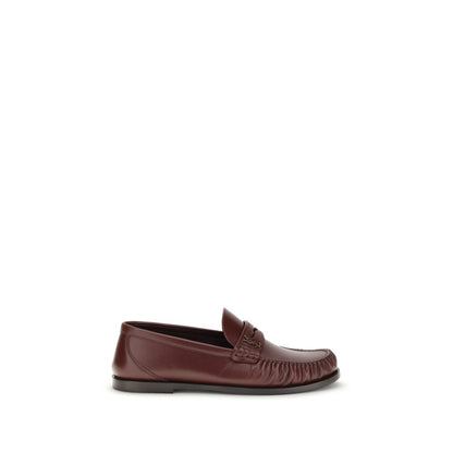 Saint Laurent Brown Calf Leather Bos Taurus Slip-On Loafers with gold Cassandre, modern moc toe, AW25 collection, side view