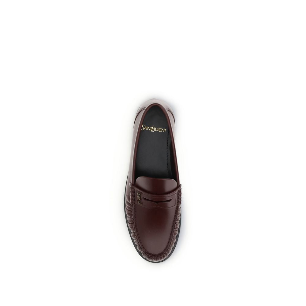 Top view of Saint Laurent Brown Calf Leather Bos Taurus Slip-On Loafers with gold Cassandre decoration, AW25 collection.