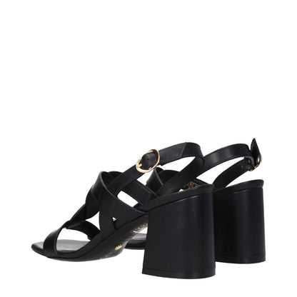 Stuart Weitzman Black Leather Platform Sandals with buckle closure and open toe, featuring mid heels and leather sole.