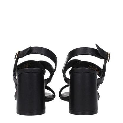 Rear view of Stuart Weitzman Black Leather Platform Sandals with buckle closure and mid heels.