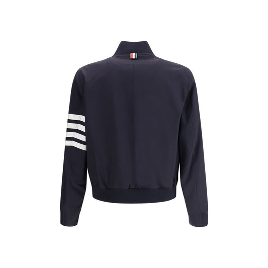 Back view of Thom Browne Wool Jacket with ribbed collar, horizontal band on sleeve, and welt pockets.