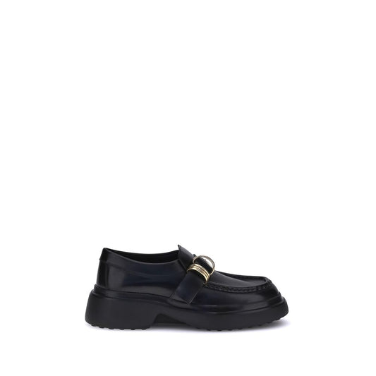 Tod's Black Rubber Platform Loafers with nappa leather and metal ring embellishments for a classic and contemporary look.