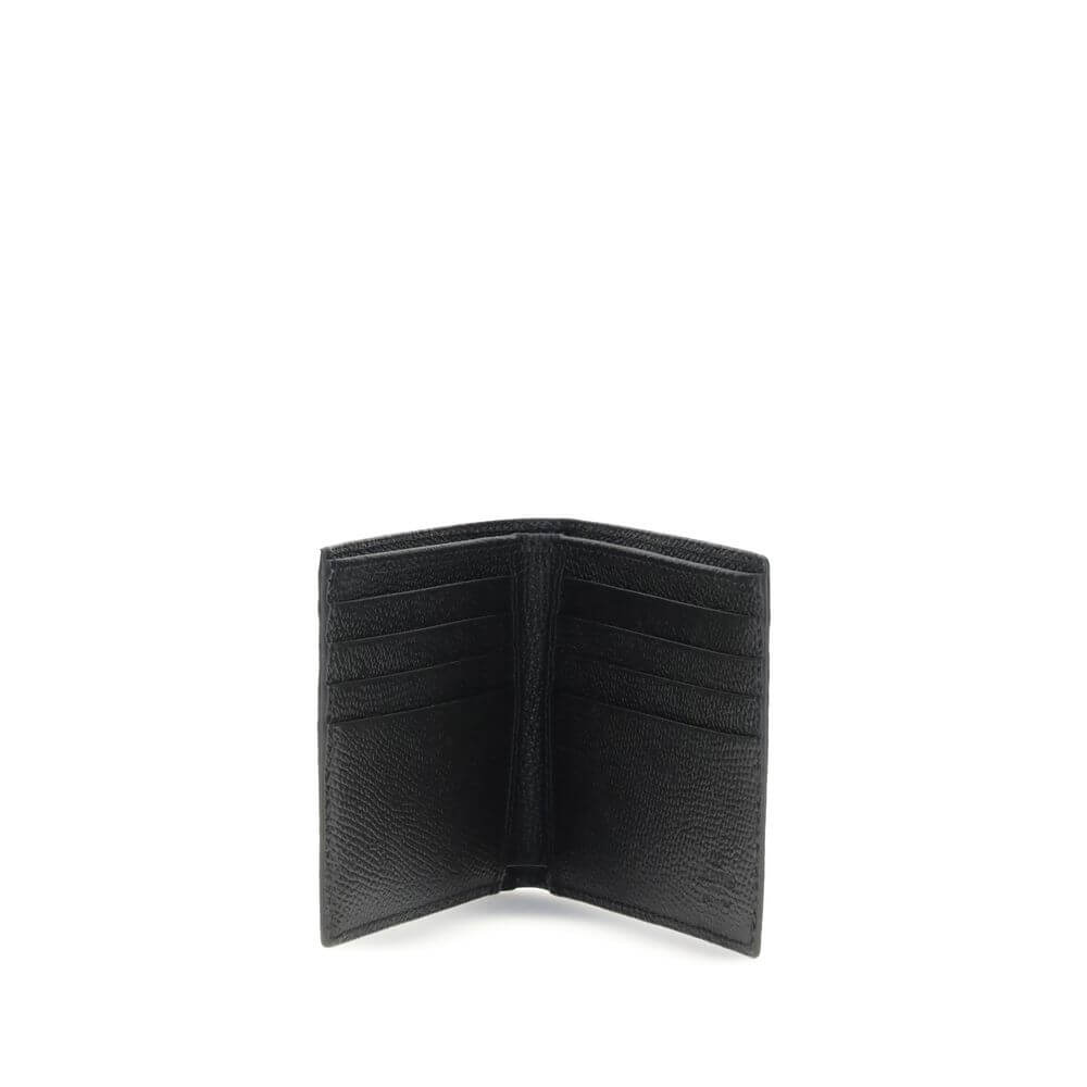 Valentino Garavani Black Calf Leather Bos Taurus Wallet with multiple card slots, open view showcasing elegant craftsmanship.