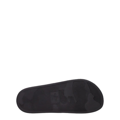 Valentino Garavani Black Cotton Slippers sole view showing rubber material and logo design, open toe, flat heel.
