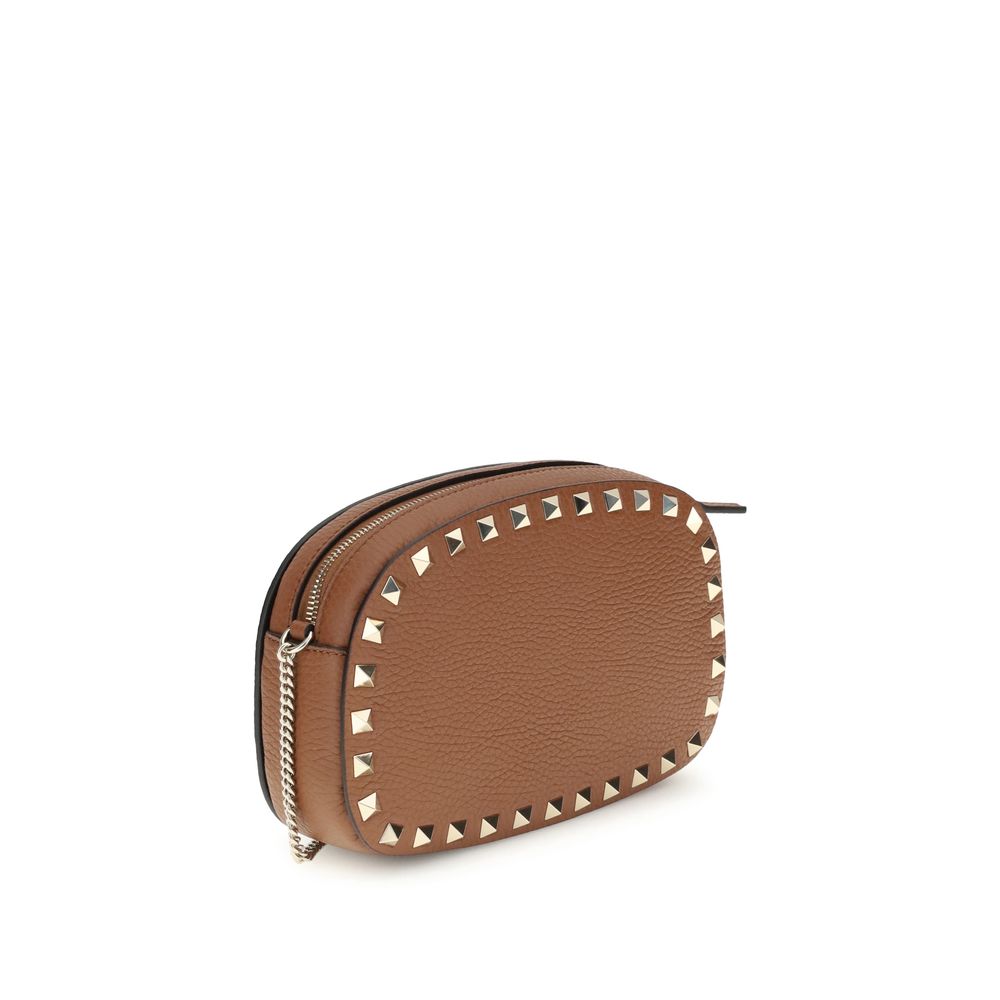 Valentino Garavani Brown Calf Leather Bos Taurus Shoulder Bag with platinum studs and adjustable chain for cross-body wear.