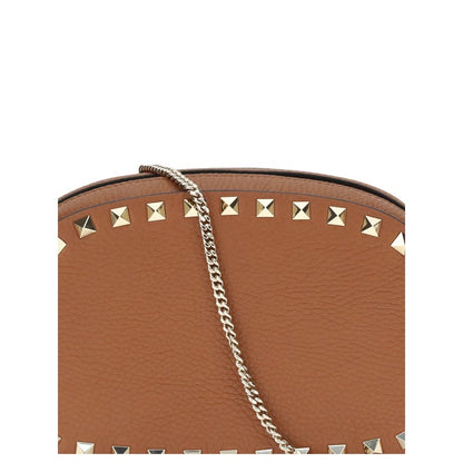 Close-up of Valentino Garavani Brown Calf Leather Bos Taurus Shoulder Bag with platinum-finish studs and chain