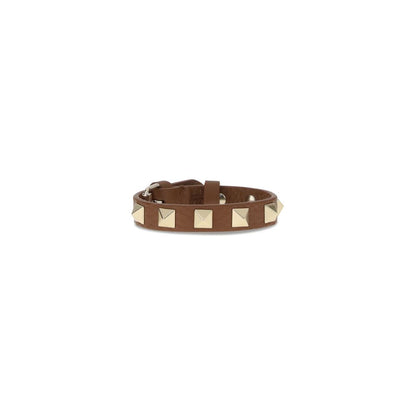 Valentino Garavani Brown Metal Bracelet with iconic stud design and buckle closure, symbolizing luxury and authenticity in fashion accessories.